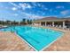 Community pool offers a refreshing retreat with lap lanes and ample seating under a covered area at 7508 Mikasa Dr, Punta Gorda, FL 33950