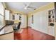 Home office with custom built-ins, desk space, and Murphy bed for flexible use at 7581 Camden Harbour Dr, Bradenton, FL 34212