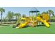 Bright and colorful community playground with slides and climbing structures for enjoyment at 7581 Camden Harbour Dr, Bradenton, FL 34212