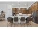 Spacious kitchen with a large center island, custom cabinets, and pendant lighting at 7765 Grande Shores Dr, Sarasota, FL 34240