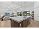 Open kitchen design with a large island connecting the living area, perfect for entertaining at 7765 Grande Shores Dr, Sarasota, FL 34240
