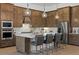 Gourmet kitchen featuring custom cabinets, quartz countertops, and stainless steel appliances at 7765 Grande Shores Dr, Sarasota, FL 34240
