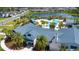 Aerial view of community clubhouse, showcasing pool, recreational amenities, and lush landscaping at 8232 Reefbay Cv, Parrish, FL 34219