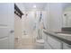 Bathroom featuring a tub, shower with curtain, subway tile, and modern sink with gray countertop at 8232 Reefbay Cv, Parrish, FL 34219