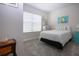 Neutral bedroom with carpet, bright windows with blinds, and tasteful decor and artwork at 8232 Reefbay Cv, Parrish, FL 34219