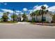 Charming community clubhouse surrounded by mature palm trees and landscaping at 8232 Reefbay Cv, Parrish, FL 34219