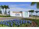 Inviting entrance to the Isles at Bayview community with lush landscaping at 8232 Reefbay Cv, Parrish, FL 34219