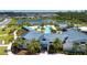 Aerial view of the community pool and clubhouse overlooking a serene lake at 8232 Reefbay Cv, Parrish, FL 34219
