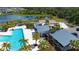 Aerial view of the community pool and splash pad area near playground and lake at 8232 Reefbay Cv, Parrish, FL 34219