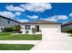 Well-maintained single-Gathering home with a two-car garage, landscaped front yard, and inviting curb appeal at 8232 Reefbay Cv, Parrish, FL 34219