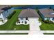 Beautiful single-Gathering home with a two-car garage, well-manicured lawn, and elegant landscaping near lake at 8232 Reefbay Cv, Parrish, FL 34219