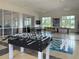 The community game room includes foosball, chess, ping pong and a shuffleboard table for hours of fun at 8232 Reefbay Cv, Parrish, FL 34219