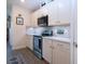 Well-lit kitchen with stainless steel appliances and ample counter space at 8232 Reefbay Cv, Parrish, FL 34219