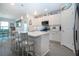 Bright kitchen featuring a center island with seating and modern appliances at 8232 Reefbay Cv, Parrish, FL 34219