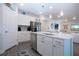 Contemporary kitchen showcases a large island, stainless steel appliances, and ample cabinet space at 8232 Reefbay Cv, Parrish, FL 34219