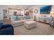 Open-concept living room with a comfortable sofa, views of the kitchen, and stylish coastal decor at 8232 Reefbay Cv, Parrish, FL 34219