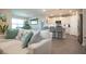 Open-concept living room seamlessly flows into the modern kitchen and dining area at 8232 Reefbay Cv, Parrish, FL 34219