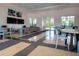 Community lounge area with tables, chairs, ceiling fans, televisions and comfortable seating creates a inviting atmosphere at 8232 Reefbay Cv, Parrish, FL 34219