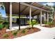 Community mailboxes under a shaded structure with landscaping and sidewalks create a convenient and attractive amenity at 8232 Reefbay Cv, Parrish, FL 34219