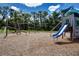 A playground with a slide, climbing bars and other features offers fun and engaging activities for children at 8232 Reefbay Cv, Parrish, FL 34219