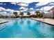 A resort-style swimming pool with sun loungers provides residents with a refreshing and relaxing amenity at 8232 Reefbay Cv, Parrish, FL 34219
