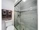 This bathroom showcases a modern glass shower with stylish tile and updated fixtures at 892 Country Club Cir # 50, Venice, FL 34293