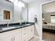 This bathroom has a double sink vanity with white cabinets and updated fixtures at 892 Country Club Cir # 50, Venice, FL 34293