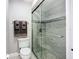This bathroom showcases a modern glass shower with stylish tile and updated fixtures at 892 Country Club Cir # 50, Venice, FL 34293