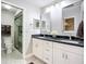 Ensuite bathroom features a double sink, granite counters, and a glass-enclosed shower at 892 Country Club Cir # 50, Venice, FL 34293
