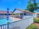 A beautiful community pool with ample seating and a covered bar area for residents' enjoyment at 892 Country Club Cir # 50, Venice, FL 34293