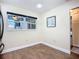 A well-lit dining area features wood flooring, a window, and a decorative picture on the wall at 892 Country Club Cir # 50, Venice, FL 34293