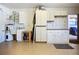 Garage featuring white cabinets, a utility sink, overhead lighting, and neutral flooring at 892 Country Club Cir # 50, Venice, FL 34293