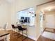 View into a modern kitchen featuring a breakfast bar, stainless steel appliances, and ample countertop space at 892 Country Club Cir # 50, Venice, FL 34293