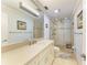 Modern bathroom featuring a glass-enclosed shower and a vanity with good lighting at 8977 Midnight Pass Rd # 519, Sarasota, FL 34242