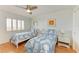 Bedroom with two beds and matching nightstands, perfect for guests at 8977 Midnight Pass Rd # 519, Sarasota, FL 34242