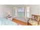 Bedroom with white shuttered windows and views of the coast at 8977 Midnight Pass Rd # 519, Sarasota, FL 34242