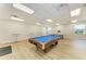 Bright game room featuring a billiards table, ping pong table, and high-top seating; the perfect space for relaxation at 8977 Midnight Pass Rd # 519, Sarasota, FL 34242