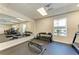 Bright gym area with mirrors, equipment, and weights; promoting wellness in the community at 8977 Midnight Pass Rd # 519, Sarasota, FL 34242