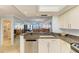 Bright kitchen with granite counters and stainless steel appliances at 8977 Midnight Pass Rd # 519, Sarasota, FL 34242