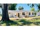 Charming backyard with patio seating, a dining area, and a well-maintained lawn at 1028 36Th E Ave, Ellenton, FL 34222
