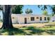 Spacious backyard with a patio area, gravel landscaping, and ample space at 1028 36Th E Ave, Ellenton, FL 34222