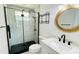 Modern bathroom featuring a glass-enclosed shower, sleek fixtures, and a stylish vanity at 1028 36Th E Ave, Ellenton, FL 34222