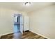 Comfortable bedroom with hardwood floors, recessed lighting, and doorway to another room at 1028 36Th E Ave, Ellenton, FL 34222