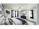 Bright bedroom featuring a ceiling fan, ample natural light, and stylish decor at 1028 36Th E Ave, Ellenton, FL 34222