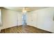 Well-lit bedroom featuring modern flooring, a ceiling fan, and access to other rooms at 1028 36Th E Ave, Ellenton, FL 34222
