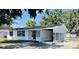 Charming single-story home with a carport, white siding, and black trim around the windows at 1028 36Th E Ave, Ellenton, FL 34222