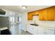 The kitchen features stainless steel appliances and ample counter space and is adjacent to the living area at 1028 36Th E Ave, Ellenton, FL 34222