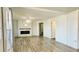 Living room area boasting modern floors and a brick fireplace at 1028 36Th E Ave, Ellenton, FL 34222