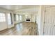 The spacious living room features modern floors, a ceiling fan, and a fireplace at 1028 36Th E Ave, Ellenton, FL 34222