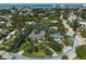 Aerial view of a property with a defined boundary, showcasing the home, landscaping, and neighborhood at 105 Island Cir, Sarasota, FL 34242
